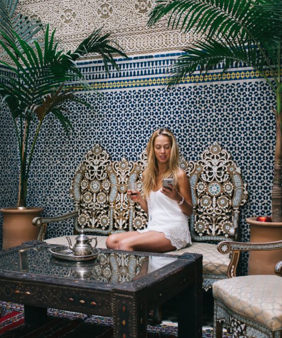 resting woman in casual light wear browsing smartp 2025 03 27 00 44 53 utc